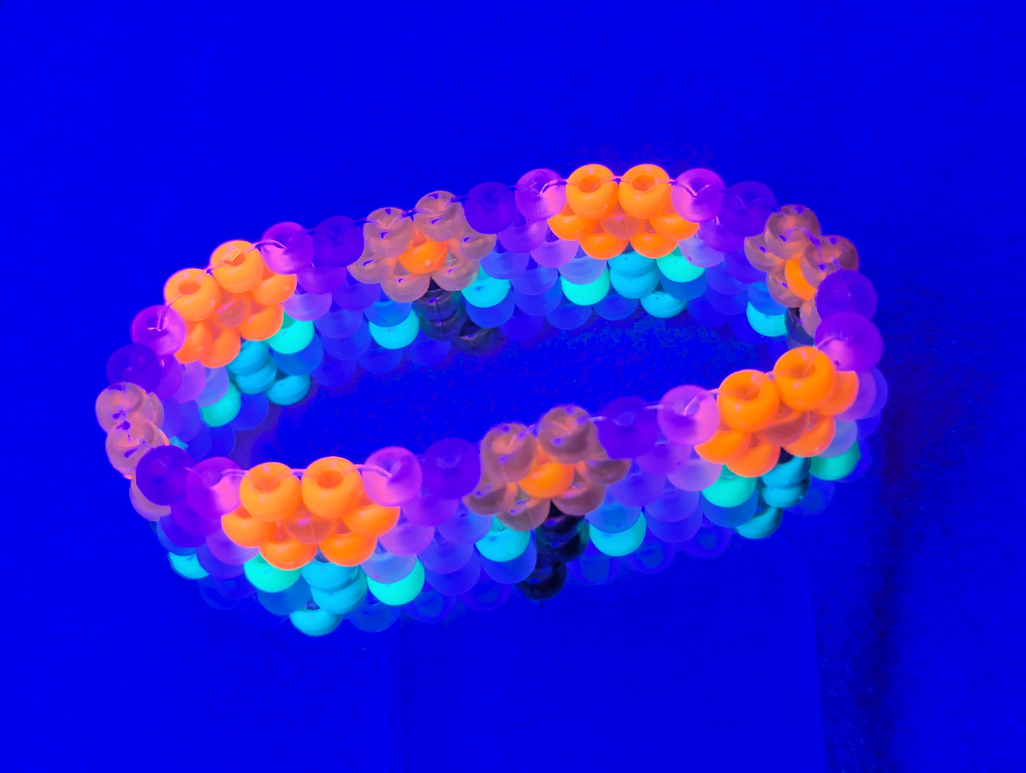 Orange and Yellow Flower Bracelet with Frosted White Background (Black Light Active)